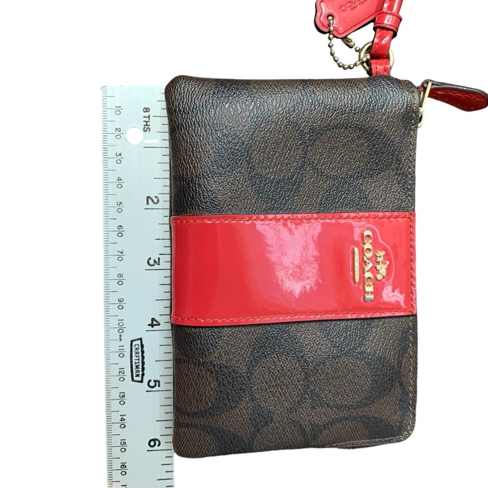 Coach corner zip wristlet wallet‎ in Signature PVC brown leather/red patent. EUC - Picture 7 of 8